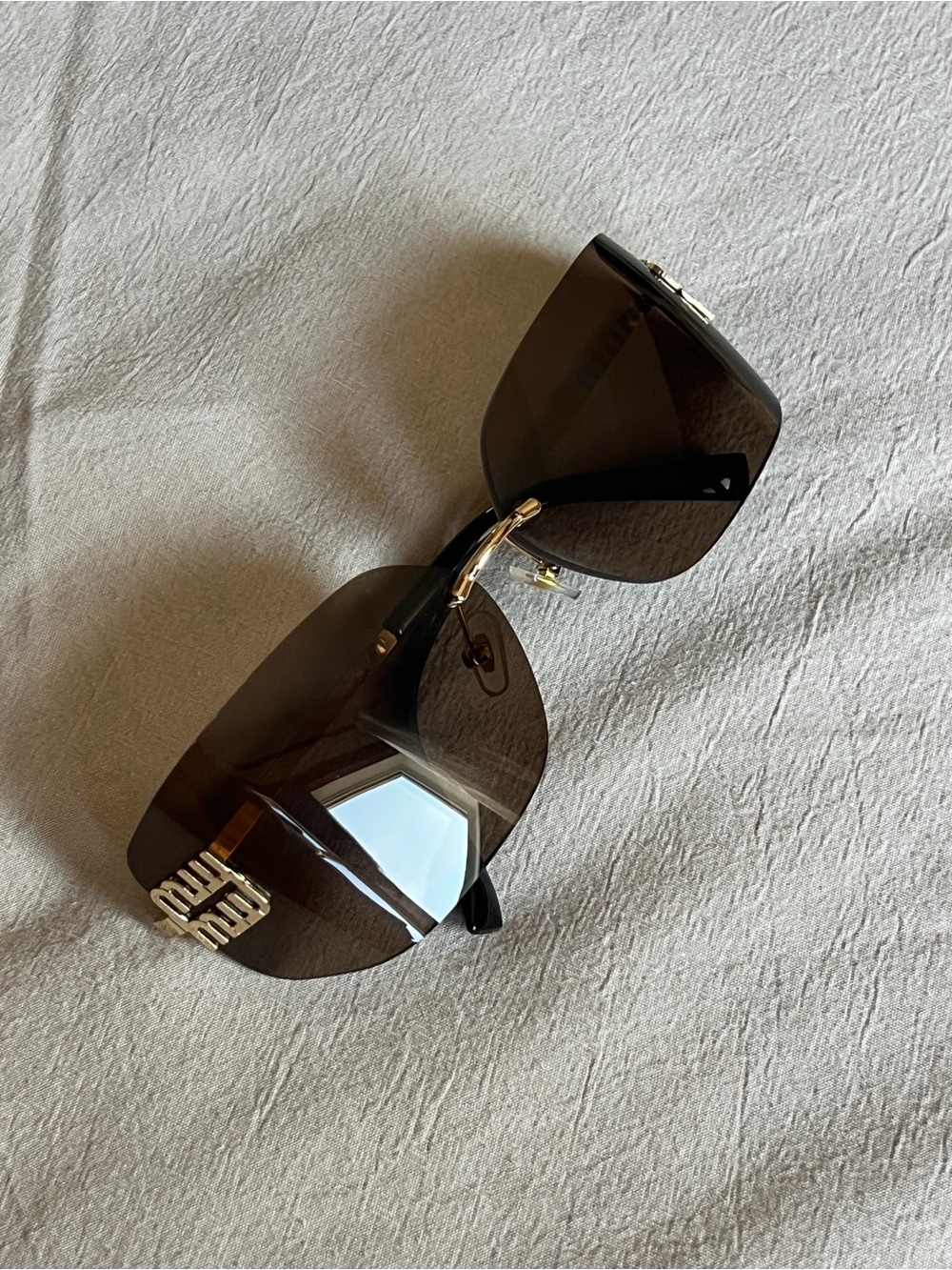 Designer Black Rimless Shield Sunglasses with Gold Accents - INSPIRED